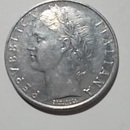 This is a well-preserved 1970 Italian 100 Lire coin.: This Italian 100 Lire coin issued in 1970 features the design of a woman and an olive branch. Country: Italy Coin Denomination: 100 Lire Year of Issue: 1970 Design: Female figure and olive branch