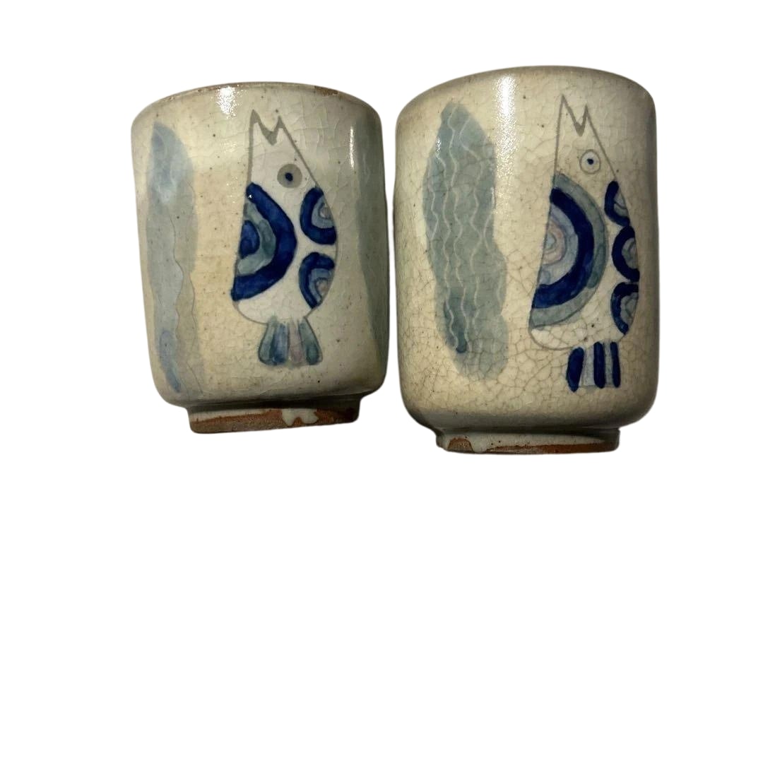 Satsuma ware, Red Kiln, Blue Fish Pattern Ceramic Cup Set (2 pieces): A ceramic cup featuring a unique blue fish pattern. Design: Ceramic cup with blue fish motif Color: White and blue Condition: Crazing on the glaze Base: Flat base with a non-slip surface It has been k