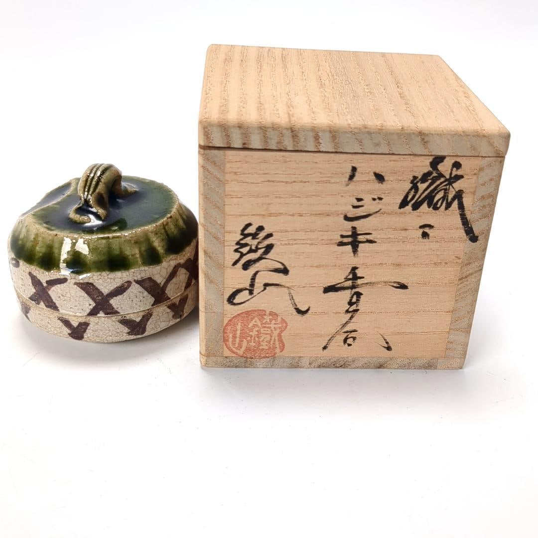 This is an Oribe-style incense box made by Yuzan. (1 of 12)
