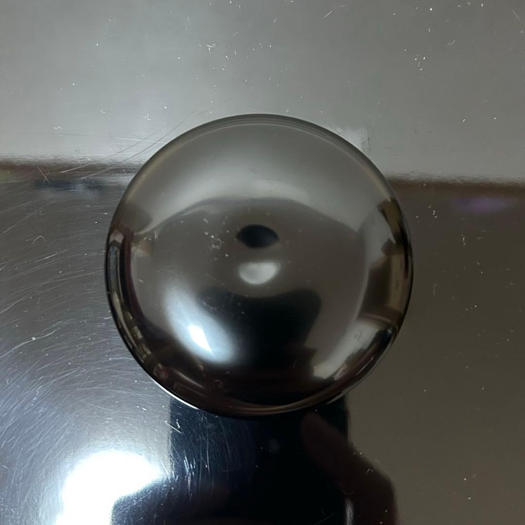 This is a flat, circular incense box. - 10