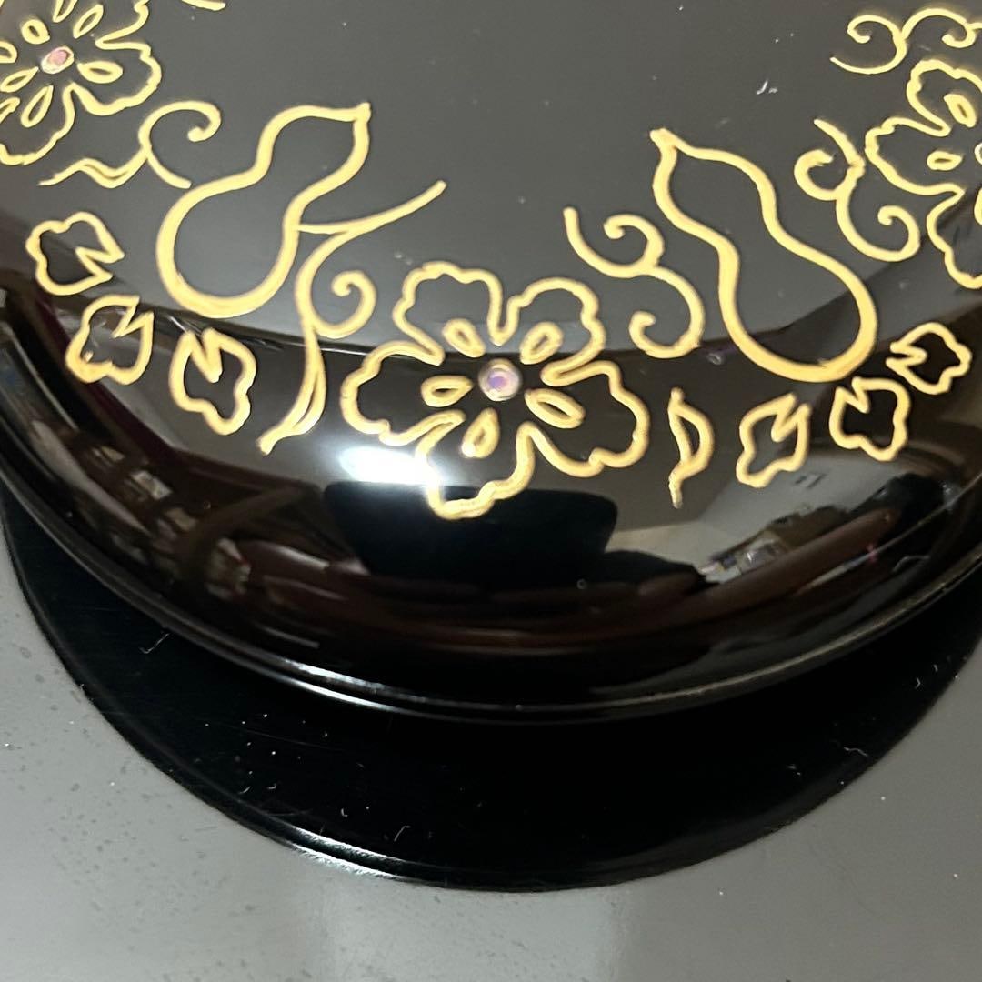 This is a flat, circular incense box. - 7