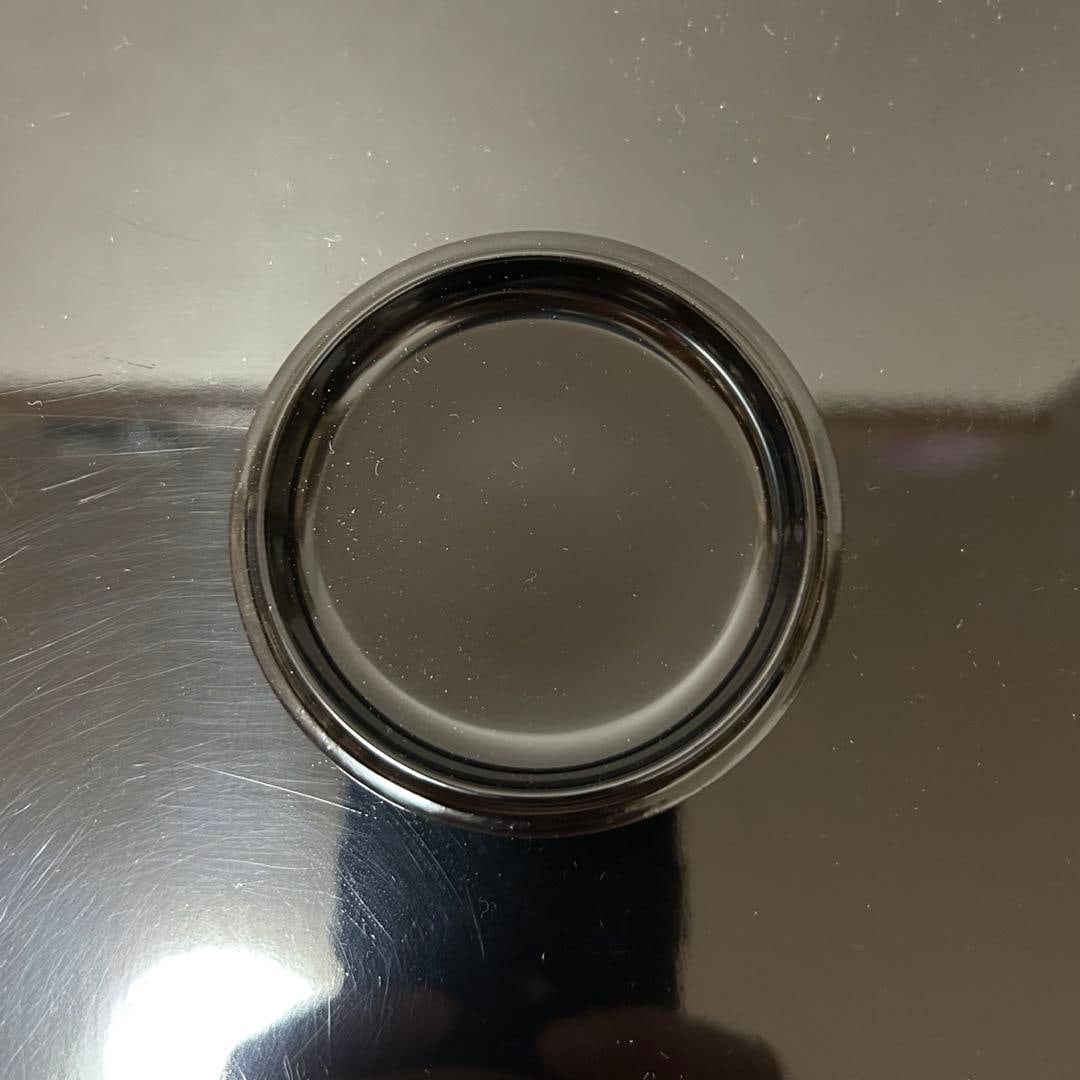 This is a flat, circular incense box. - 9
