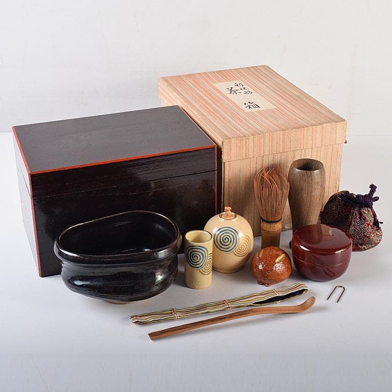 A set of nine pieces, including a vermilion Rikyu-style tea caddy, a black shoe-shaped tea bowl (1 of 20)
