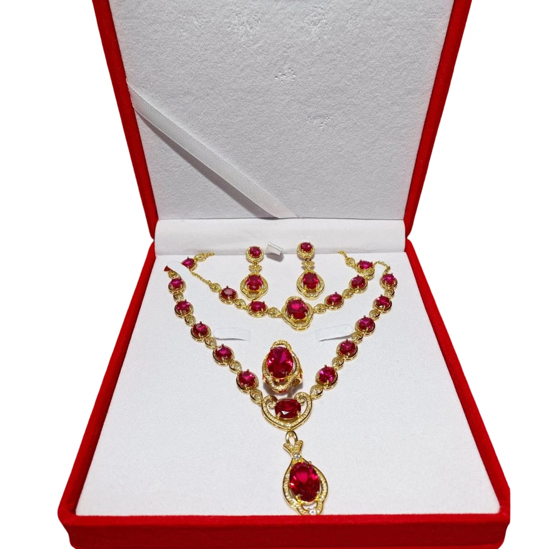 Gold Inlaid Ruby Jewelry: This set of gold inlaid ruby jewelry, including a necklace, ring, bracelet, and earrings, showcases exquisite craftsmanship and luxurious design. The rubies are vibrant in color, and the metal parts
