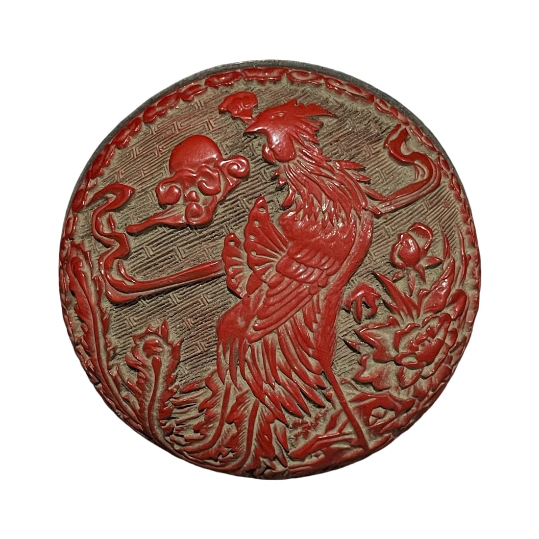 Carved Red Lacquer Box with Phoenix and Peony Design: This carved red lacquer box features an exquisite phoenix and peony design, showcasing meticulous craftsmanship and vibrant colors. The box is well-formed with a thick lacquer layer, reflecting the