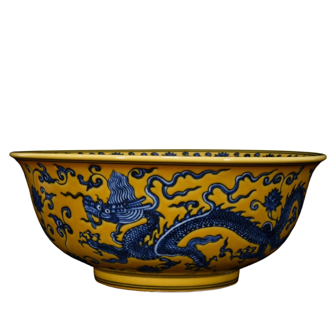 Ming Xuande Yellow Ground Blue and White Dragon Pattern Bowl: The yellow ground blue and white dragon pattern bowl from the Ming Xuande period is renowned for its unique color combination and exquisite craftsmanship. The blue and white dragon pattern on the
