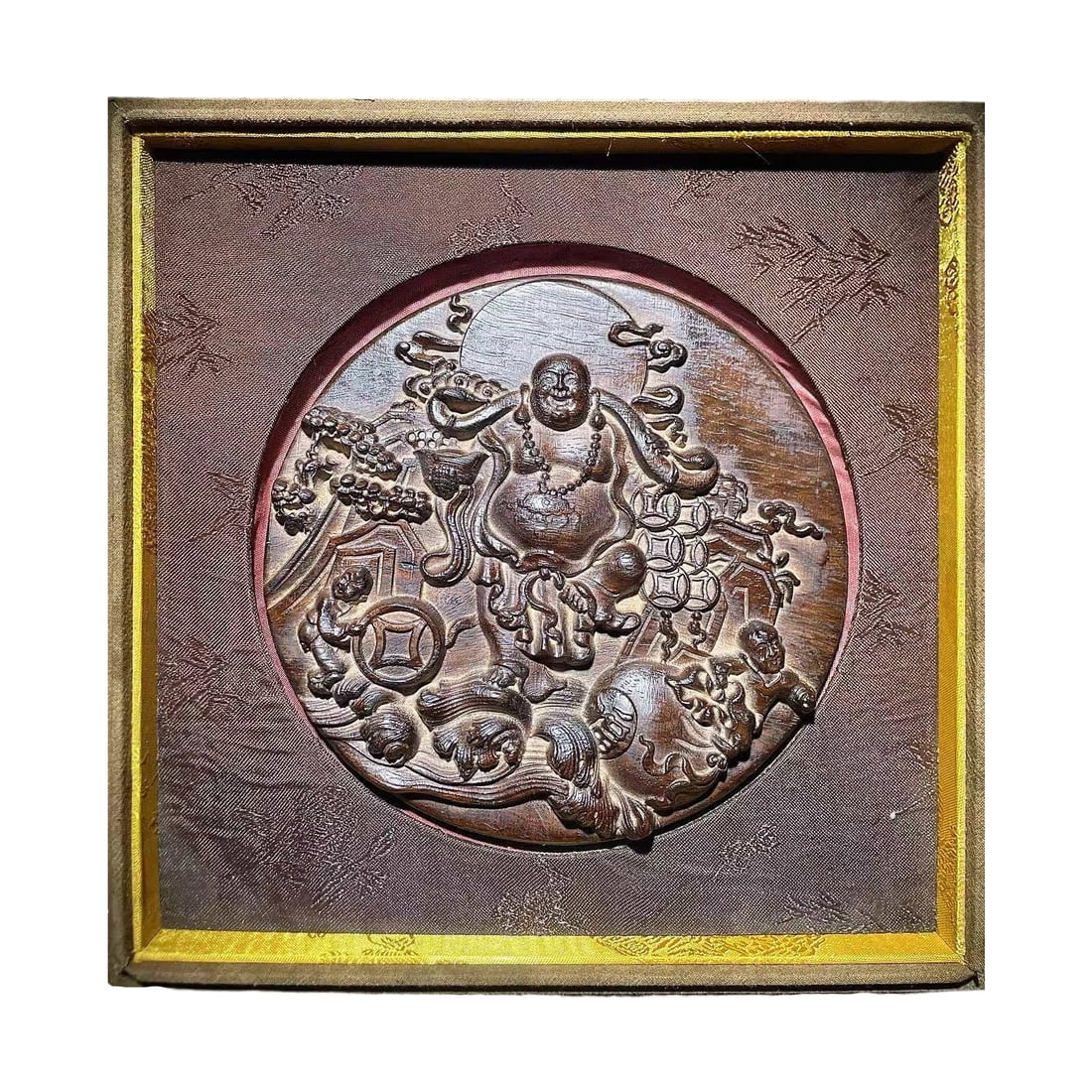 Agarwood Maitreya Buddha Figurine: This agarwood Maitreya Buddha figurine is carved from a single piece, showcasing the natural grain and fragrance of the agarwood. The figure of Maitreya Buddha is full and rounded, with a benevolent