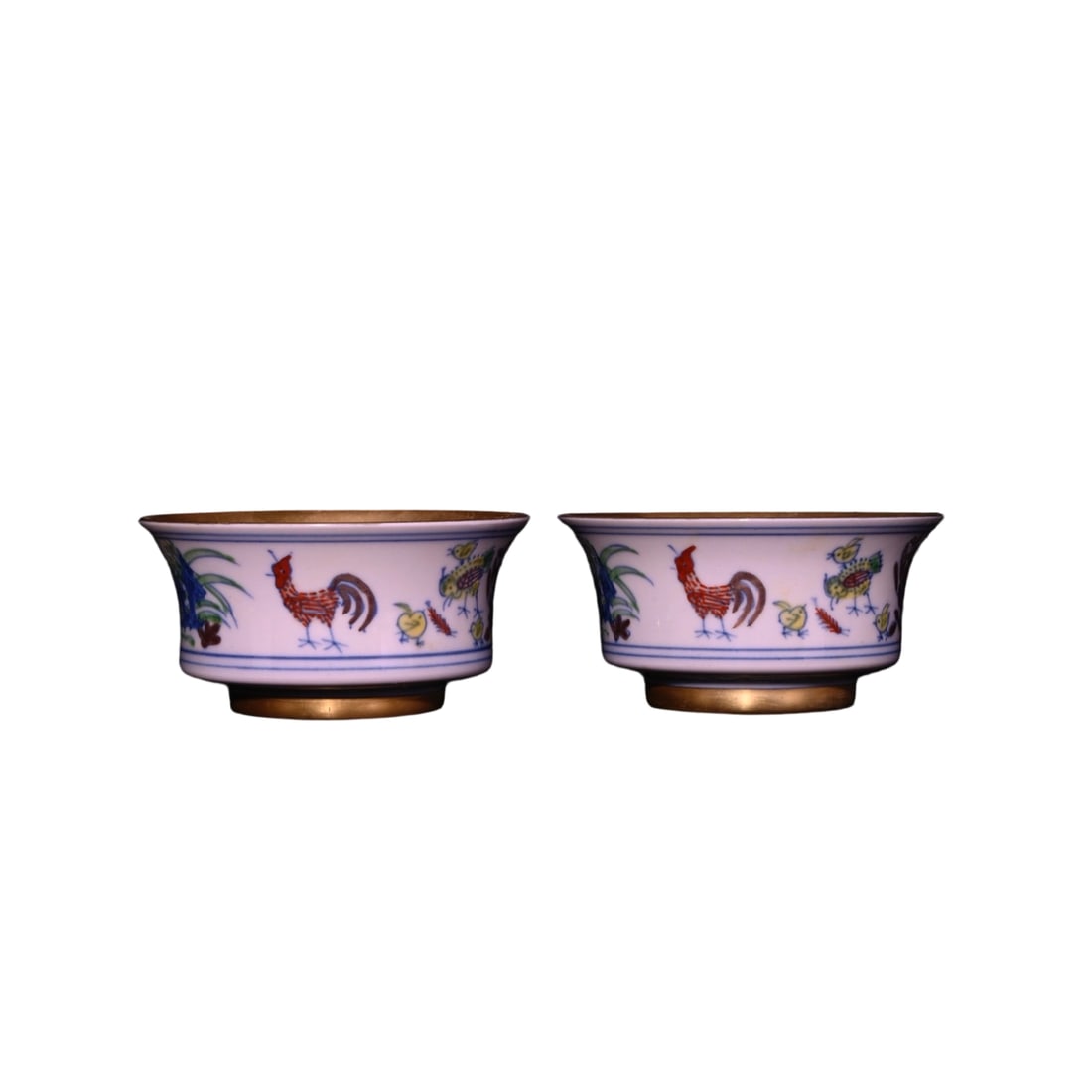 Ming Chenghua Red Body Doucai Gilded Chicken Pattern Cup: The Ming Chenghua period red body doucai gilded chicken pattern cup is renowned for its exquisite craftsmanship and unique artistic style. The cup features a red body base with lively chicken patterns