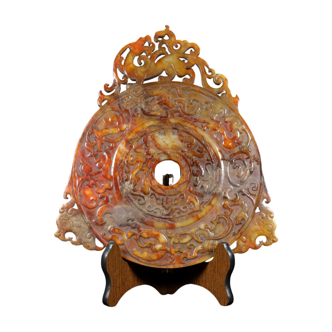 Hetian Old Jade Dragon and Phoenix Bi: This Hetian old jade bi features a dragon and phoenix motif, with a warm jade texture and an ancient hue. The intricate carving brings the dragon and phoenix to life, symbolizing auspiciousness. The