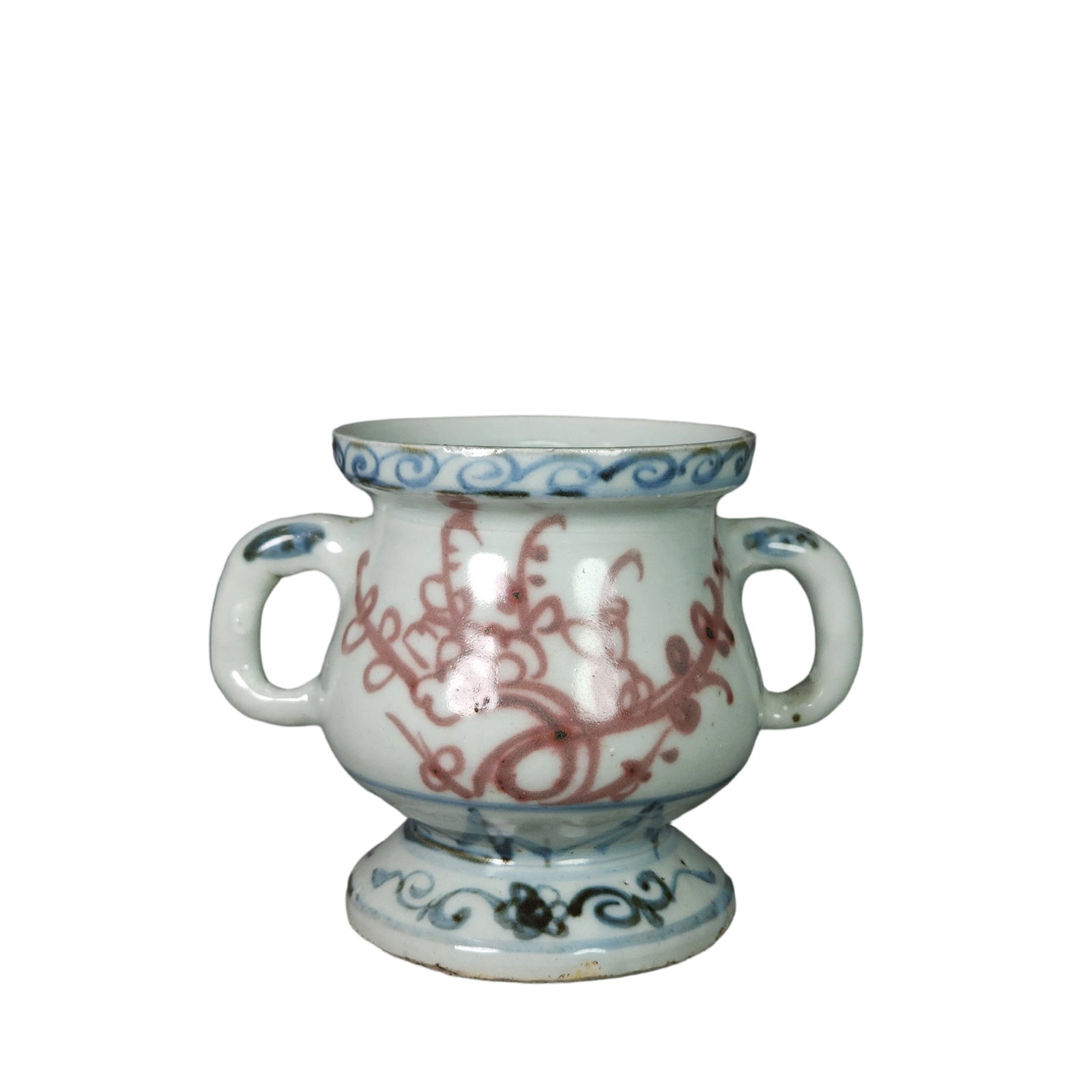 Ming Dynasty Blue and Red Glazed Double-Eared Censer: This Ming Dynasty blue and red glazed double-eared censer showcases the exquisite craftsmanship of Ming porcelain. The combination of blue and red glaze offers a striking contrast, creating a strong