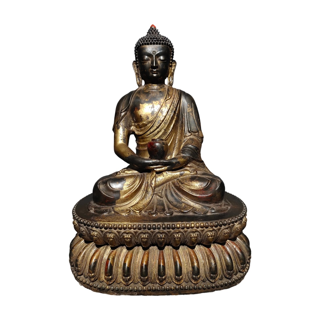 Pure Copper Gilded Shakyamuni Buddha Statue: This Shakyamuni Buddha statue is crafted from pure copper with exquisite gilding. The statue is well-proportioned and substantial, featuring a full and three-dimensional lotus throne with clear