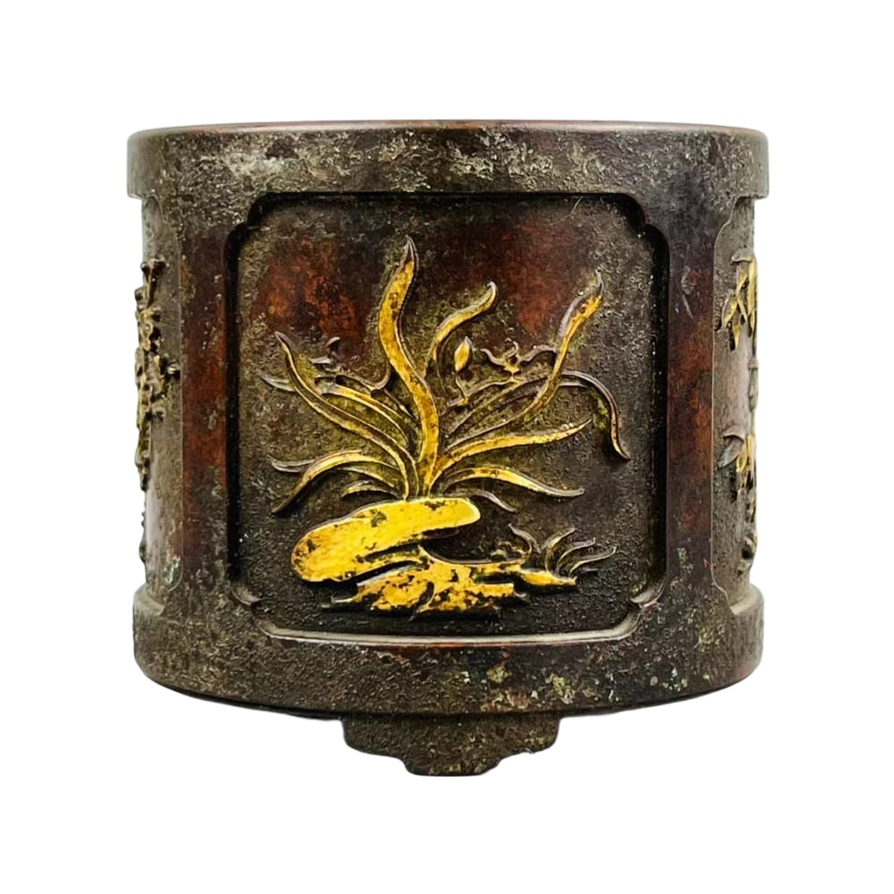 Ming Dynasty Gilt Incense Burner with Plum, Orchid, Bamboo, and Chrysanthemum Motifs: This incense burner is from the Ming Dynasty, Xuande period, featuring gilt craftsmanship with plum, orchid, bamboo, and chrysanthemum motifs. It has a three-legged design, with a regular shape and