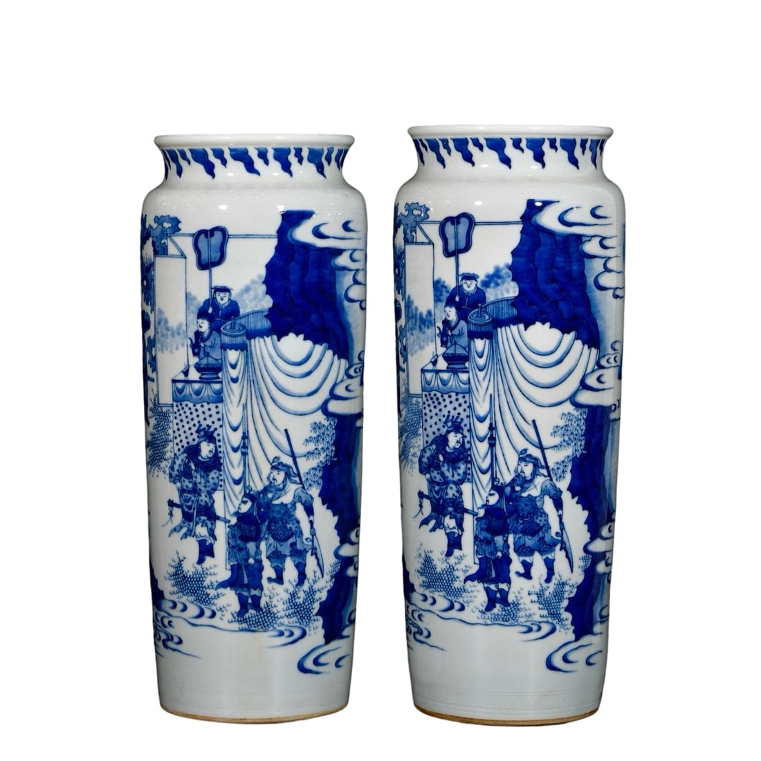 Pair of Qing Dynasty Blue and White Story Scene Cylindrical Vases: This pair of blue and white cylindrical vases is renowned for its exquisite story scene motifs, showcasing the superb craftsmanship of Qing Dynasty porcelain. The intricate and vivid designs, with