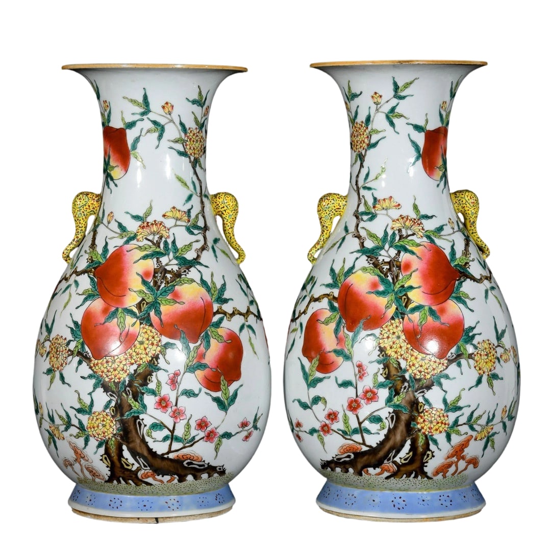 Qing Dynasty Famille Rose Double Elephant-Handled Vase with Nine Peaches and Longevity Motif: This pair of famille rose vases features a motif of nine peaches and longevity, symbolizing longevity and good fortune. The vibrant colors and exquisite craftsmanship, along with the unique elephant h