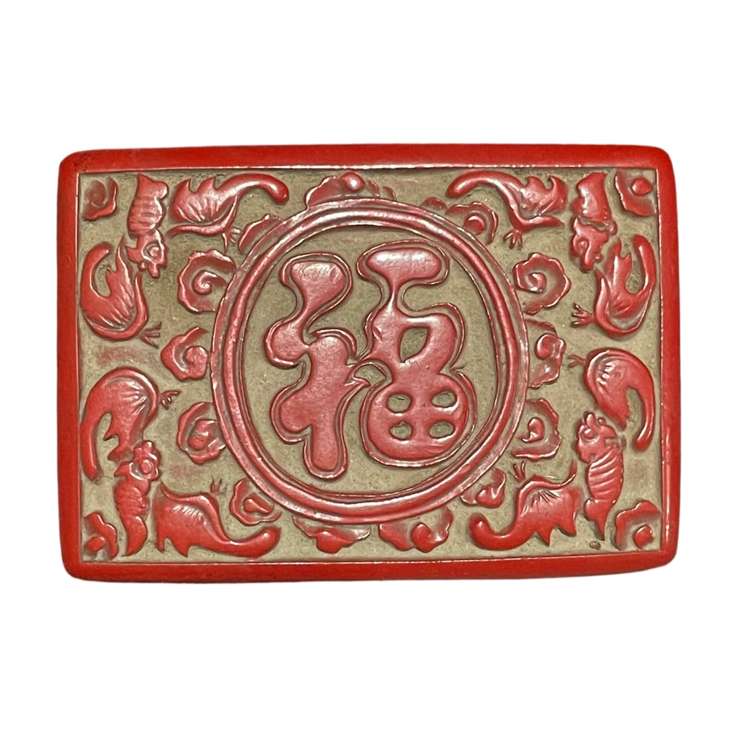 Carved Red Lacquer Box with Fu and Shou Motifs: This carved red lacquer box features motifs of Fu and Shou, showcasing exquisite craftsmanship with vibrant lacquer and distinct layers, reflecting the high skill of traditional lacquerware