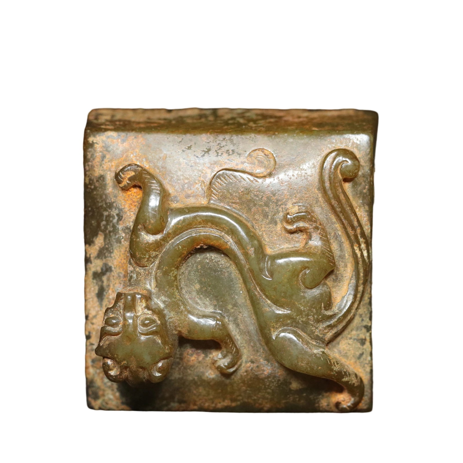 Han Dynasty Hetian Jade Dragon Knob Seal: This Han Dynasty Hetian jade seal features exquisite craftsmanship and fine jade quality, with an aged patina that reflects the superb ancient techniques. The dragon knob design adds a sense of