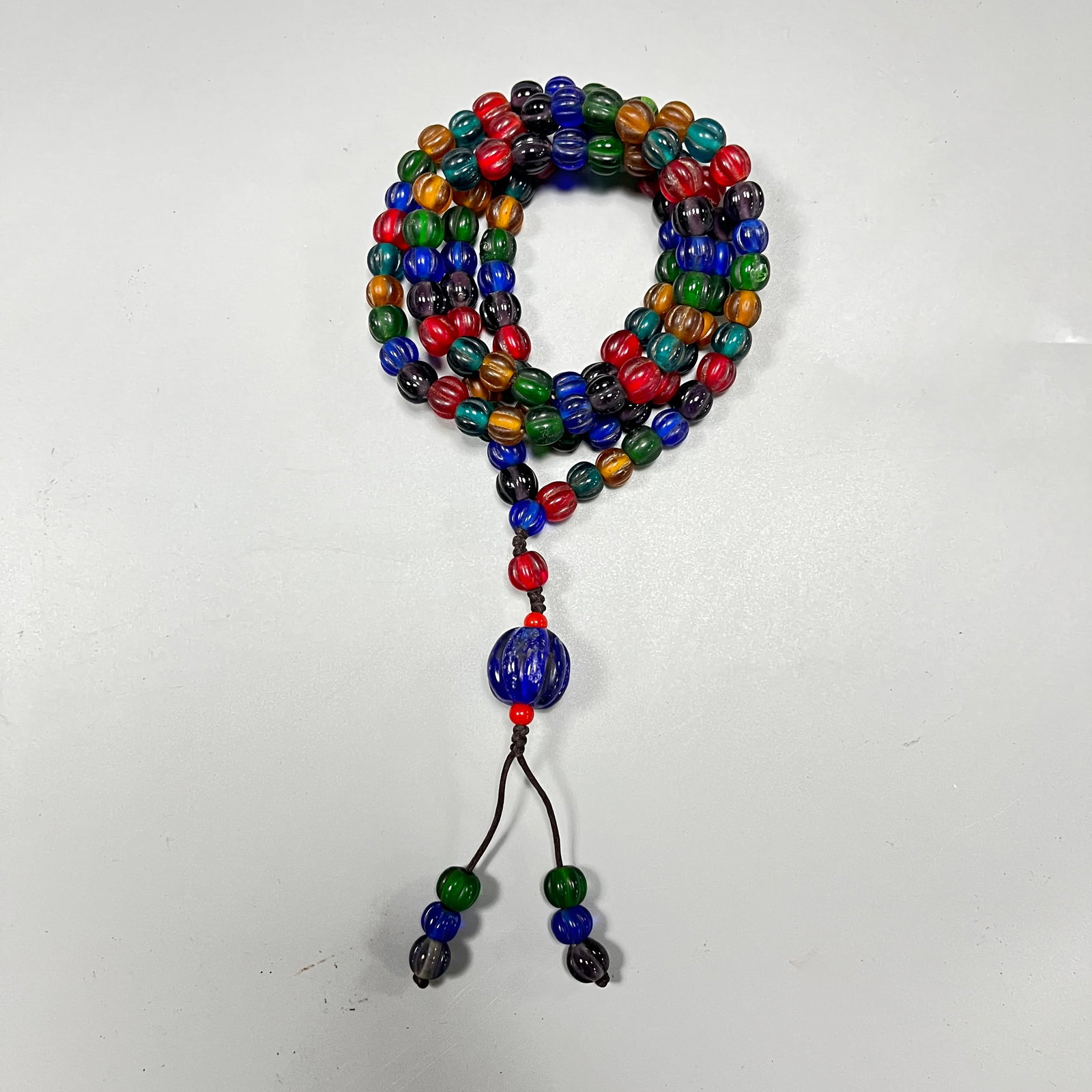 Glass Buddhist bead necklace and bracelet: Glass Buddhist bead necklace/bracelet, 8mm in size, with a 15mm diameter bead at the bottom.