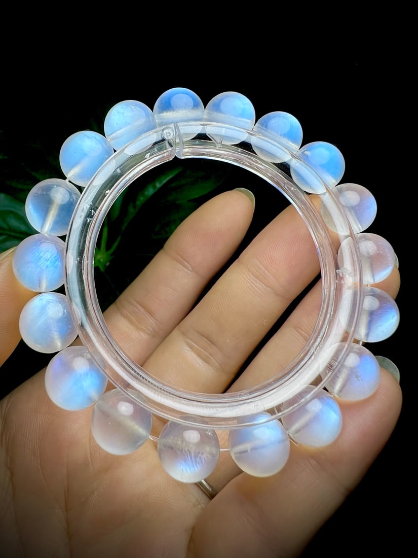 Natural Blue Moonstone Bracelet: This bracelet features translucent blue moonstones that emit a captivating blue glow. The creamy texture combined with the intense blue light showcases its unique charm. Elegant and stylish when worn.