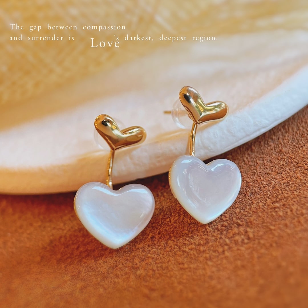 18K Gold Natural White Mother-of-Pearl Earrings: These earrings feature natural white mother-of-pearl, showcasing an elegant double-heart design. The use of 18K gold adds a touch of luxury, suitable for various occasions.