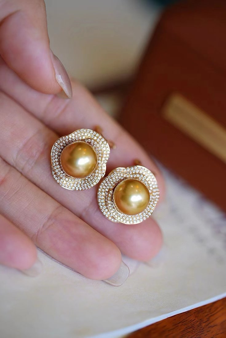 Gold Pearl Earrings: These earrings captivate with their rich golden hue and dazzling luster. Featuring top-grade gold pearls with a diameter of 11mm, they are round and nearly flawless, with a radiant sheen. Perfect for 