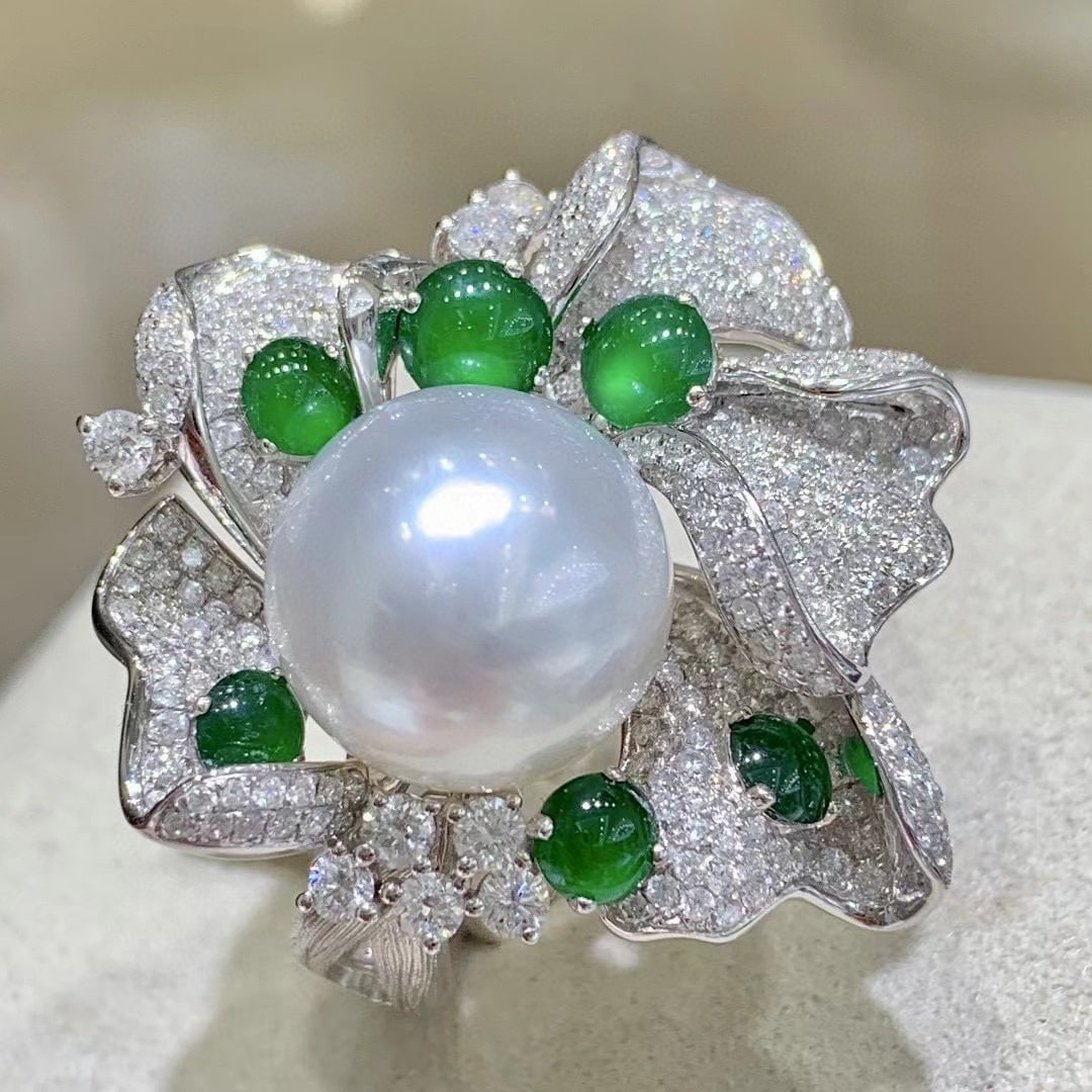 S925 Silver Pearl Ring: This ring features a base of S925 silver, adorned with a 12 to 13 mm slightly blemished round pearl, showcasing a perfect blend of classic and elegance. The adjustable design ensures comfortable and f