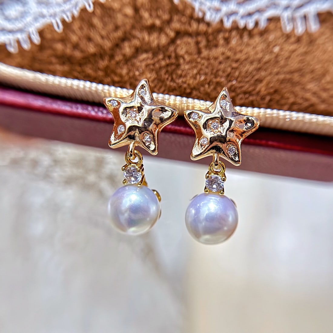 Natural Pearl Earrings: These earrings feature natural pearls, showcasing the natural luster and elegance of the pearls. The high quality of the pearls makes them a classic jewelry choice.