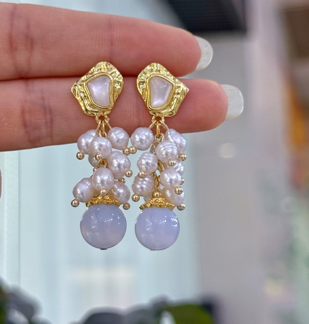 Natural Pearl and Blue Chalcedony Earrings: These earrings feature a sophisticated combination of natural pearls and blue chalcedony in an elegant tassel design. Each pearl and chalcedony is carefully selected to ensure high quality and unique