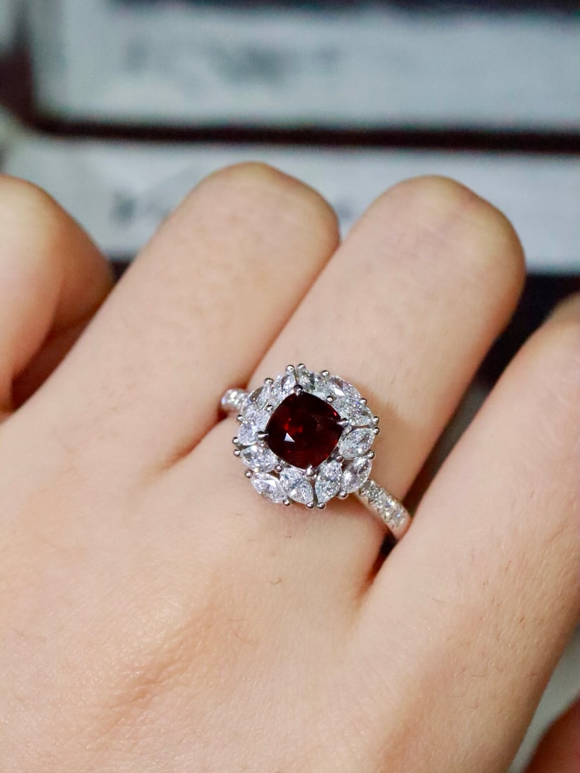 PT950 Natural Unheated Ruby Ring: This ring features a natural unheated Mozambique ruby as the centerpiece, showcasing a fiery hue akin to flames, yet with a gentle and delicate luster. Its subtle contrast exudes vitality and