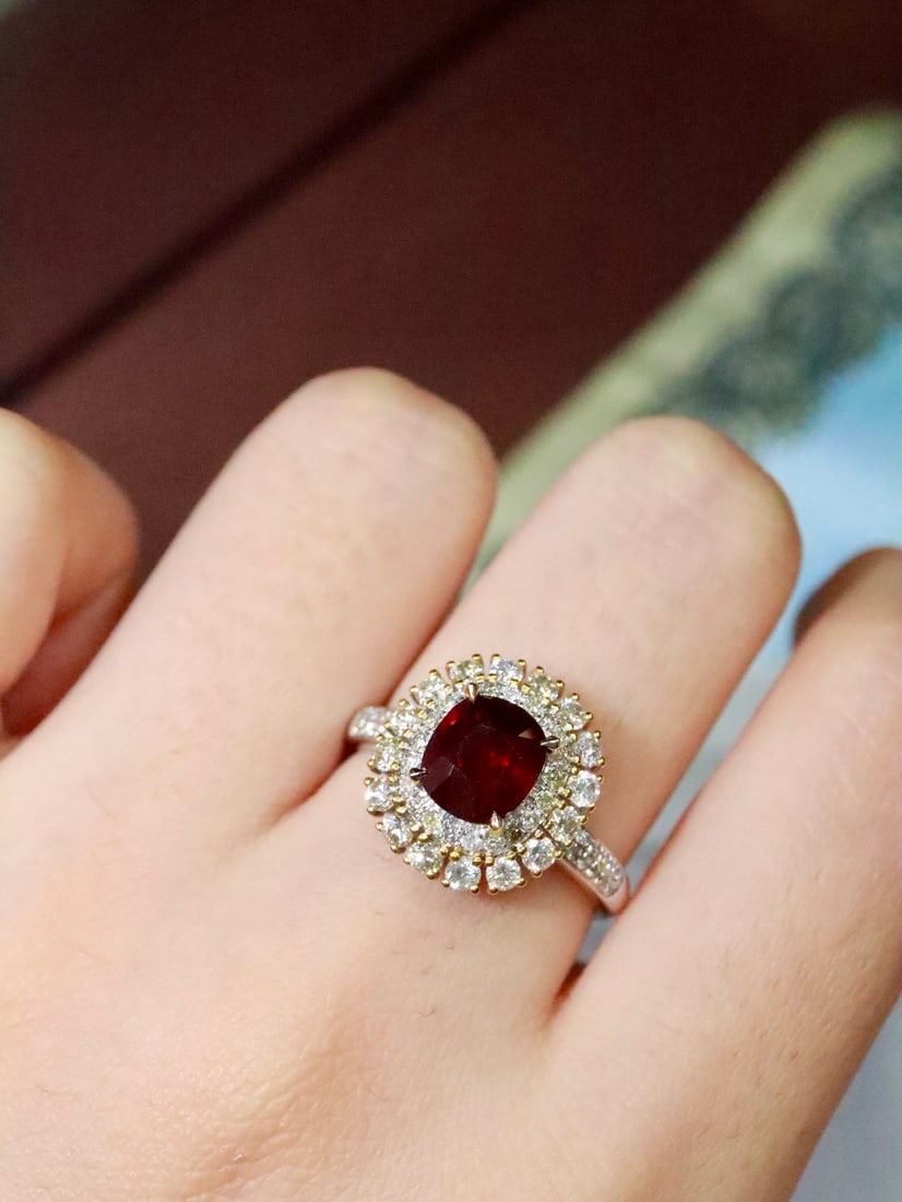 18K Gold Natural Ruby Ring: This 18K gold ruby ring showcases the enchanting pigeon blood red hue, exuding an aura of elegance. It reveals its unique charm from every angle, enhancing the wearer's complexion. (Total weight 3.91g
