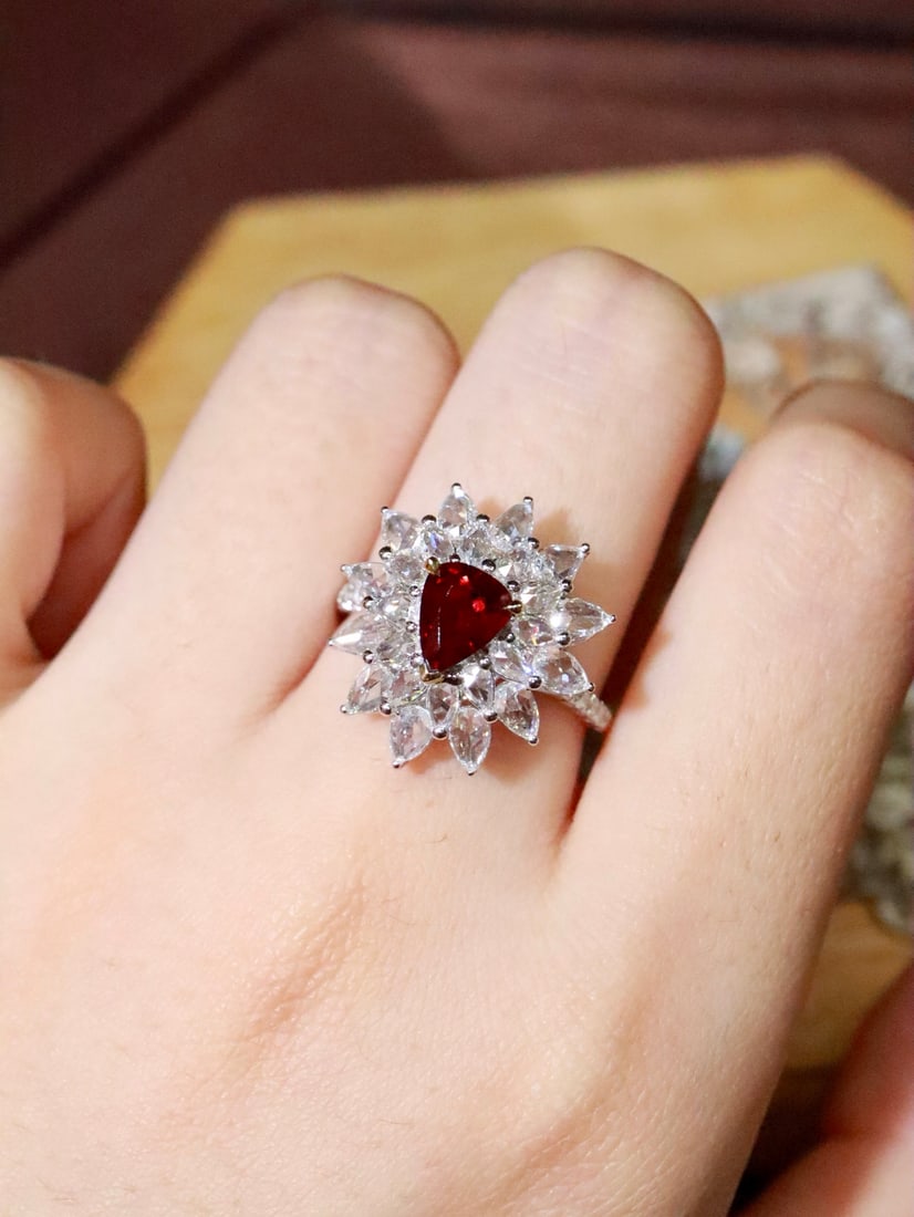 18K Gold Natural Unheated Ruby Ring: This ring features a vivid red ruby at its center, showcasing a perfect blend of luxury and elegance. The delicate craftsmanship of 18K gold complements the natural allure of the unheated ruby,
