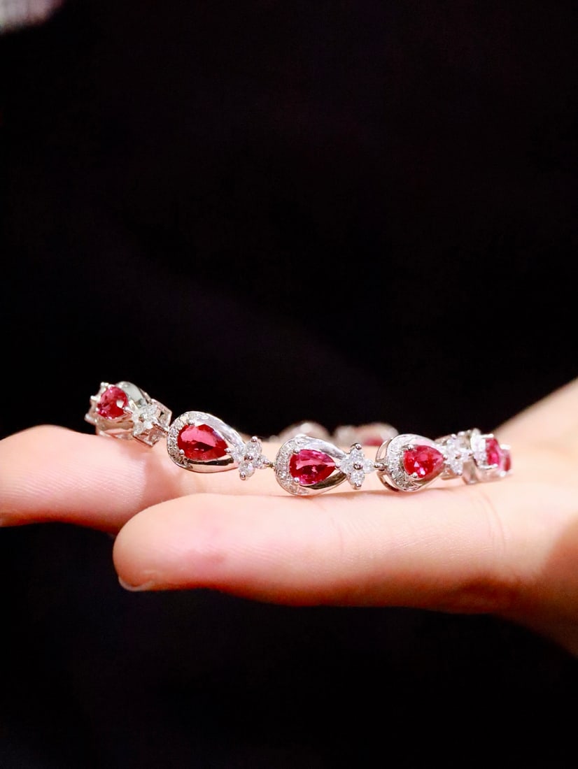 18K Gold Unheated Ruby Bracelet: This bracelet is crafted from 18K gold, featuring an unheated ruby that exudes a fiery brilliance and naturally vivid color. The addition of diamonds enhances its luxurious appeal. (Gold weight