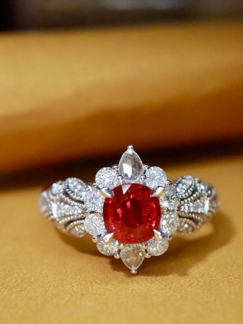 Platinum Natural Unheated Ruby Ring: Platinum outlines delicate patterns, resembling winding vines, gently embracing the vibrant unheated ruby. Like a dialogue of souls, it releases a subtle and enchanting charm in the interplay of