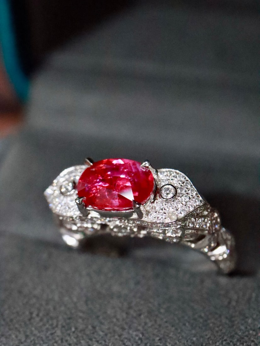 Platinum Unheated Ruby Ring: This ring features an unheated ruby as the main stone, showcasing the unique allure of natural gemstones. The platinum setting, adorned with surrounding diamonds, exudes luxury and elegance. The