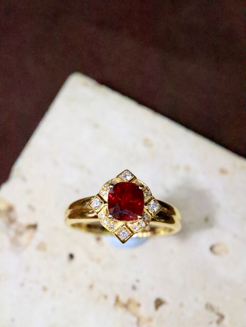 18K Gold Natural Unheated Pigeon's Blood Ruby Ring: This ring features an unheated pigeon's blood ruby set in 18K gold, with a staggered design that adds dimension. Its elegant shape elongates the finger, exuding nobility and elegance. (Gold weight 2.3