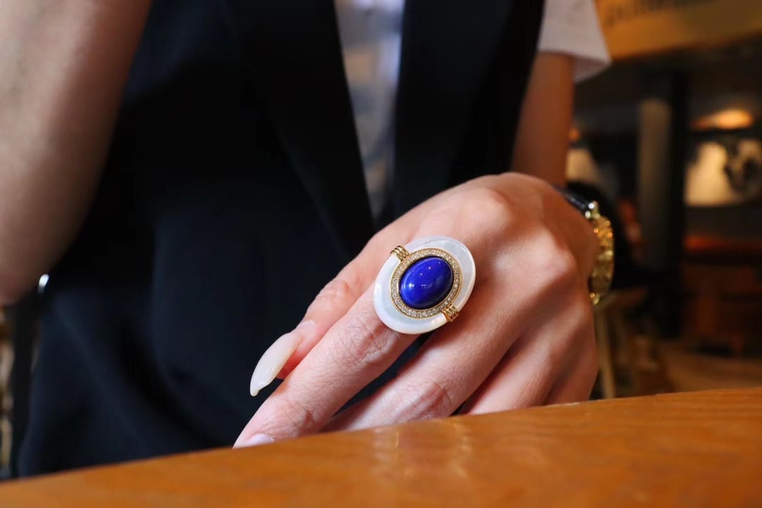 Natural Lapis Lazuli and Natural White Mother-of-Pearl Ring: This ring combines the elegant charm of natural lapis lazuli and natural white mother-of-pearl, showcasing a unique color contrast. Made with s925 silver, the gold plating ensures lasting color. The a