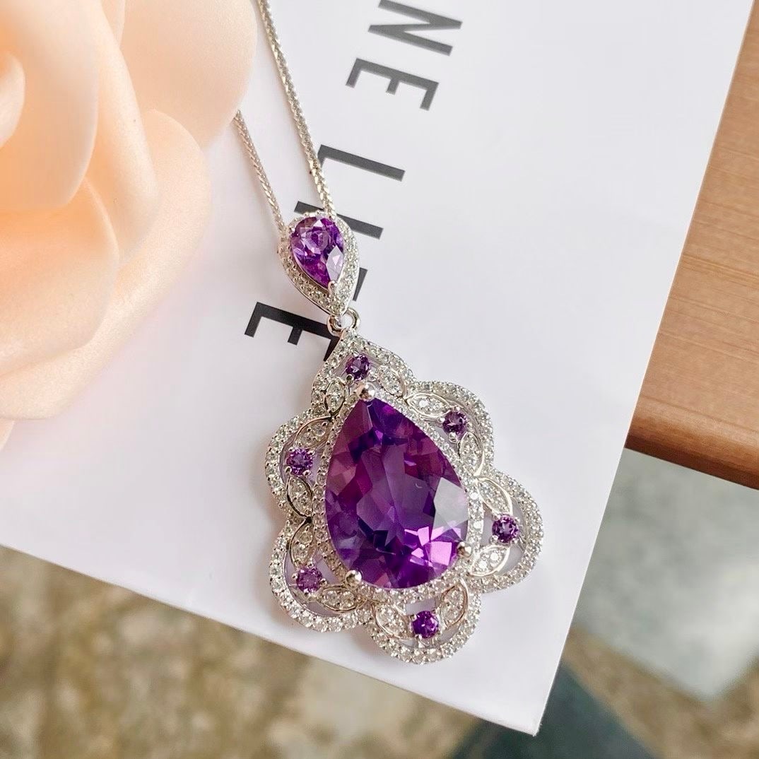 925 Silver Amethyst Pendant: This pendant is meticulously crafted in 925 silver, set with a teardrop-shaped amethyst that exudes enchanting brilliance. The addition of high-carbon diamonds adds a touch of luxury. Suitable for any