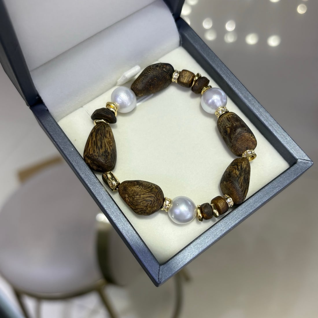 Natural White South Sea Pearl Bracelet: This bracelet is made of natural white South Sea pearls, showcasing a unique Baroque style. The natural color and imperfections of the pearls give it a distinctive character and charm.
