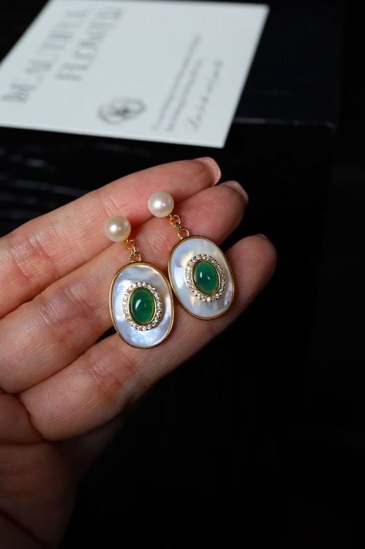 Natural Green Chalcedony and Natural White Mother-of-Pearl Earrings: These earrings feature natural green chalcedony and natural white mother-of-pearl as the main stones, showcasing an elegant color contrast. The silver gilding process adds lasting luster and texture.