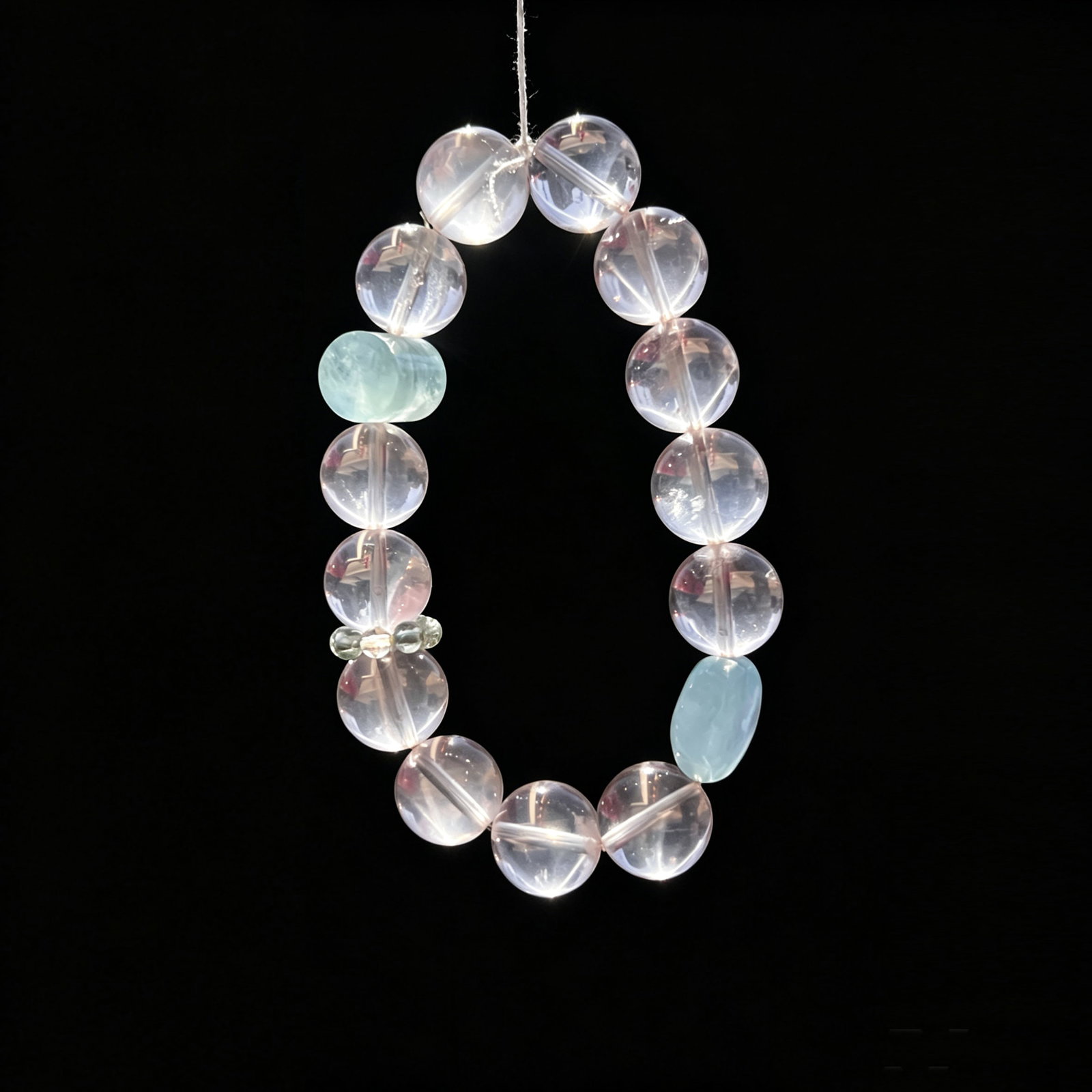 Natural Rose Quartz and Aquamarine Bead Bracelet with Clear Quartz Spacers: Elegant natural gemstone bracelet composed of polished rose quartz beads accented with aquamarine and clear quartz spacer beads. The soft translucent pink tones paired with pale blue accents create a 