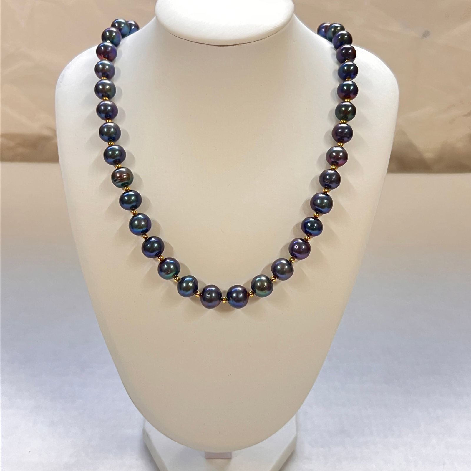 Tahitian Black Pearl Long Necklace Approx. 10-11MM Adjustable Length: An elegant Tahitian black pearl long necklace featuring pearls visually estimated at approximately 10-11MM in diameter. The pearls display attractive deep gray, blue, and peacock green overtones with 