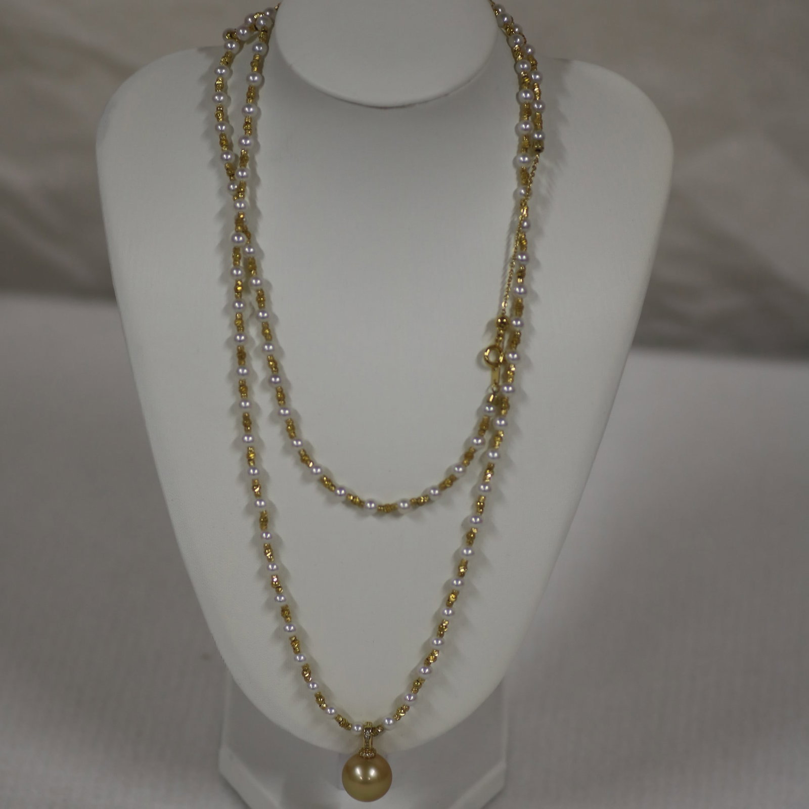 Natural Golden Seawater Pearl & Akoya Pearl Long Necklace with Pearl Pendant, Certificate Included: This elegant multifunction pearl long necklace combines natural golden seawater pearls with smaller Akoya pearls, creating a balanced layered appearance suitable for multiple styling options.The neckl