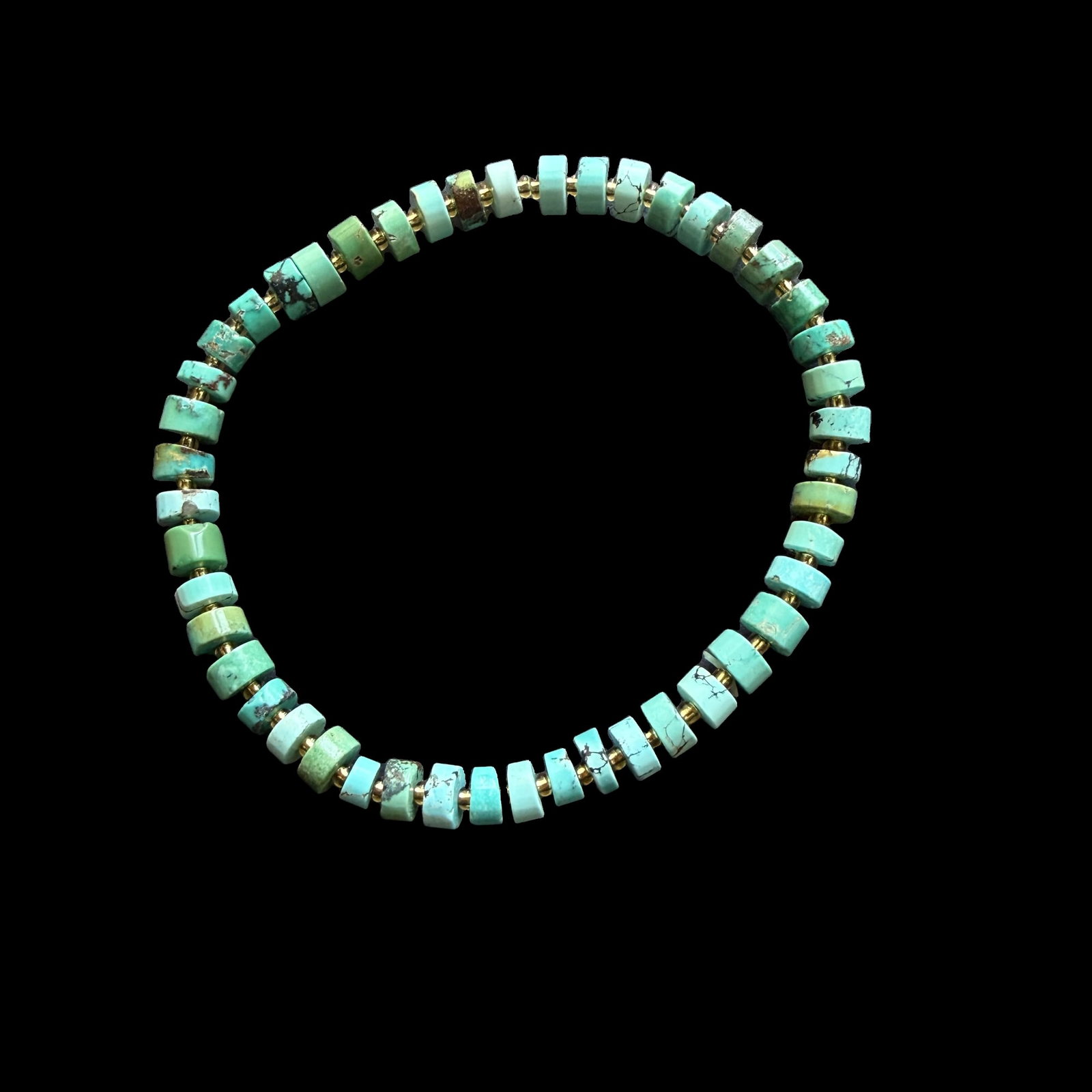 Natural Turquoise Beaded Bracelet with Gold-Tone Spacer Beads, Round Disc Beads, Approx. 8g Estate: A natural turquoise beaded bracelet composed of polished round disc-shaped turquoise beads accented with gold-tone spacer beads. The bracelet displays attractive blue-green tones with natural matrix v