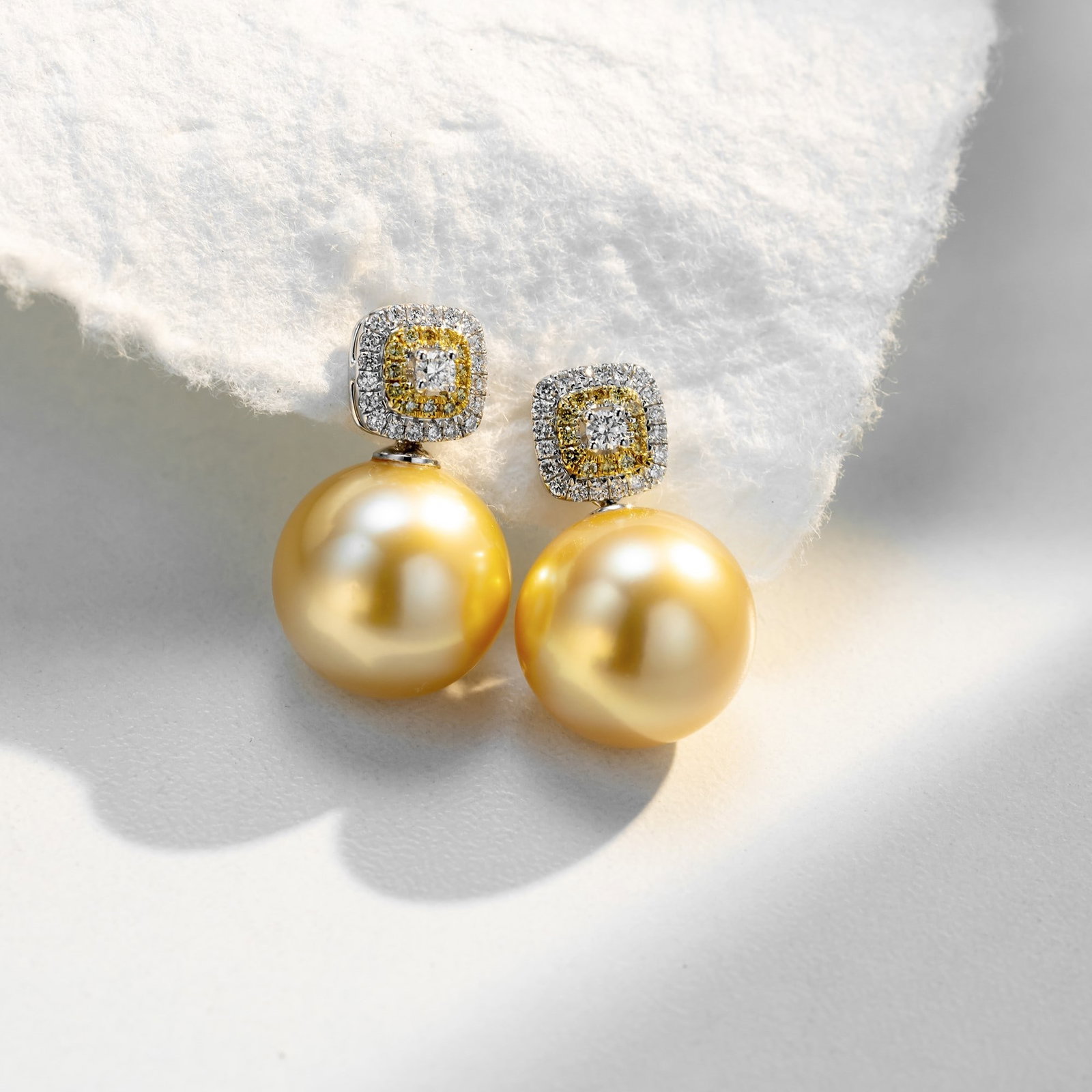 18K South Sea Golden Pearl Diamond Earrings, 13-14 mm Pearls, Yellow & White Diamonds: Crafted with 18K Yellow Gold or 18K White Gold earring fittings (customer's choice), this elegant pair of earrings features lustrous South Sea Golden Pearls measuring approximately 13-14 mm. The near-