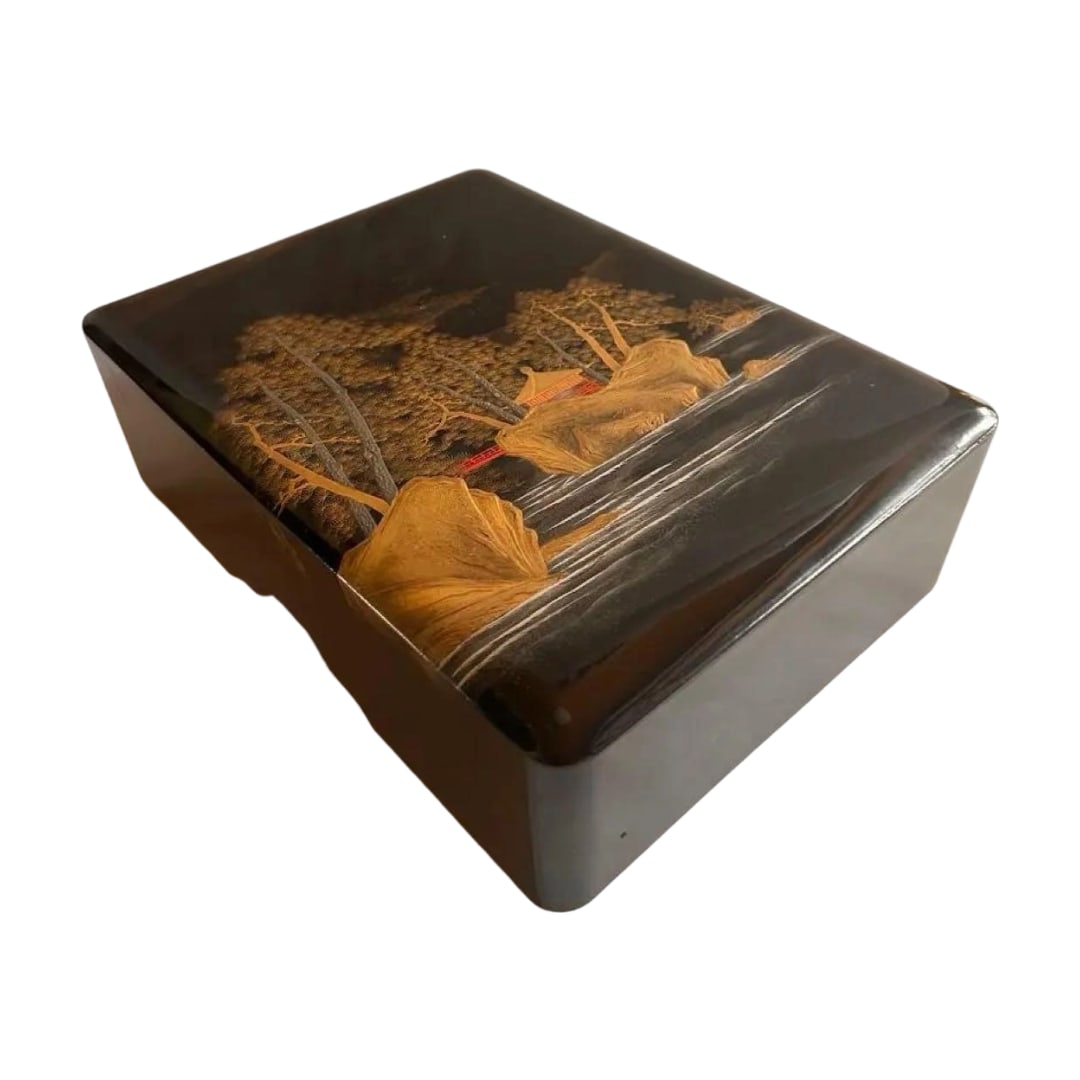 Maki-e Landscape Painting Lacquer Box: A rectangular writing box with landscape maki-e. Design: Landscape maki-e, depicting mountains and rivers Color: Contrast of black and gold Shape: Rectangular writing box Decoration: Intricate