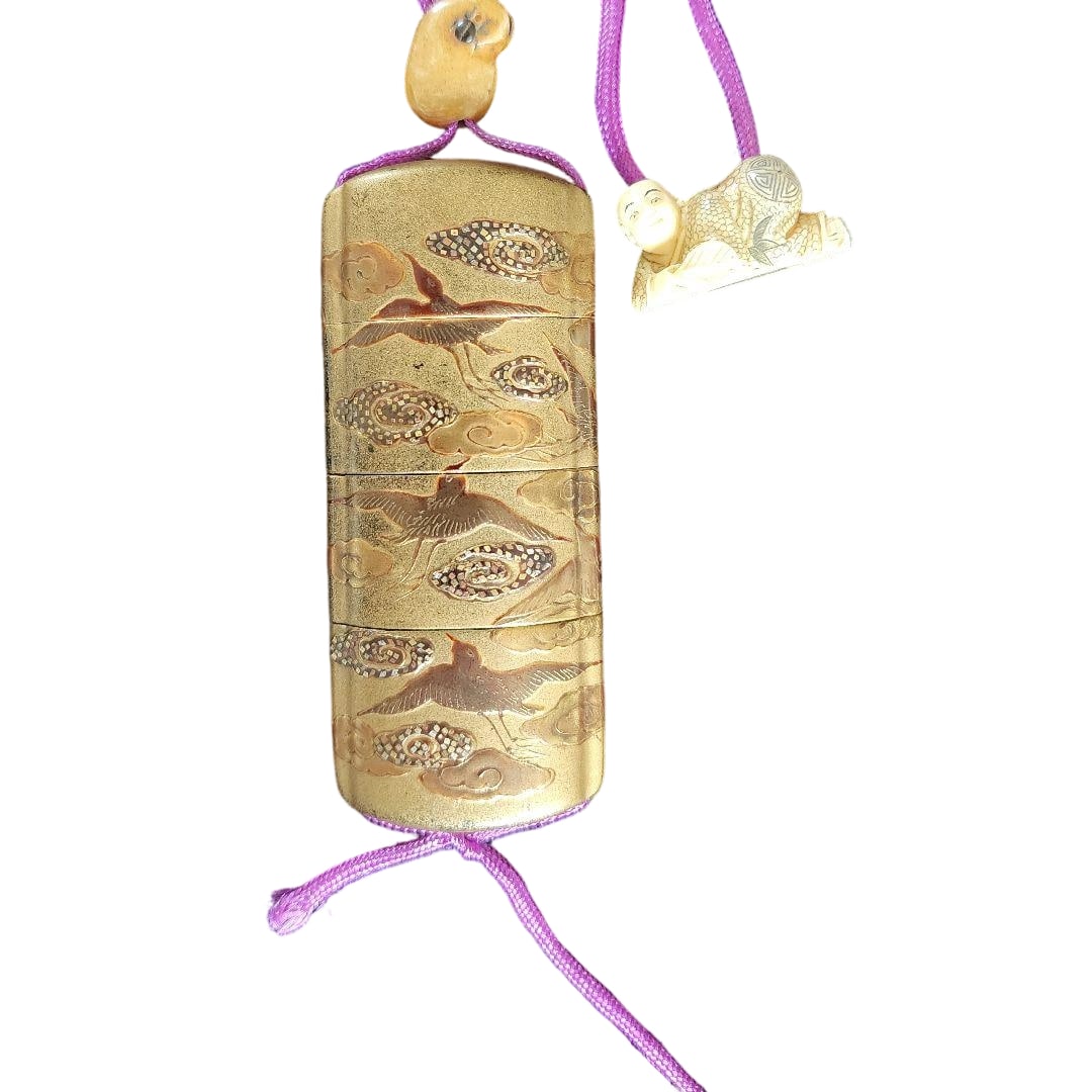 Inro with Maki-e Bird Motif, with Ojime and Netsuke Attached: This is a four-tiered stacking box intricately decorated with bird motifs using the Kinko maki-e technique, accompanied by an ojime and a netsuke. There is minimal wear, and the condition is very good