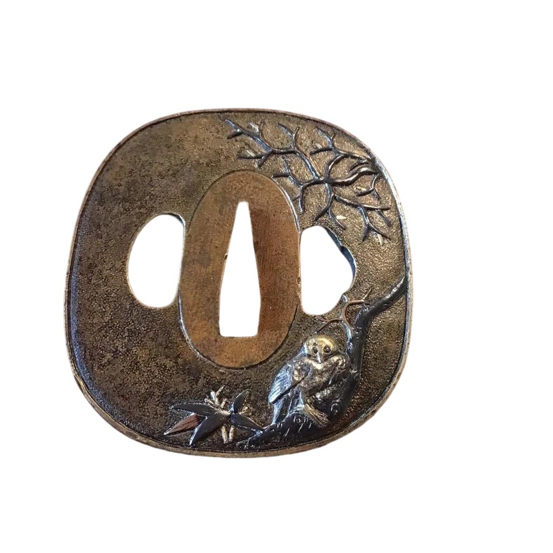 Tsuba (Sword Guard), with a bronze base and silver inlay, adorned with an owl motif, guaranteed to: Tsuba (Sword Guard), with a bronze base and silver inlay, adorned with an owl motif, guaranteed to be an Edo period creation. Accompanied by the original box. Dimensions (mm) Height 67 Width 64 Thickn