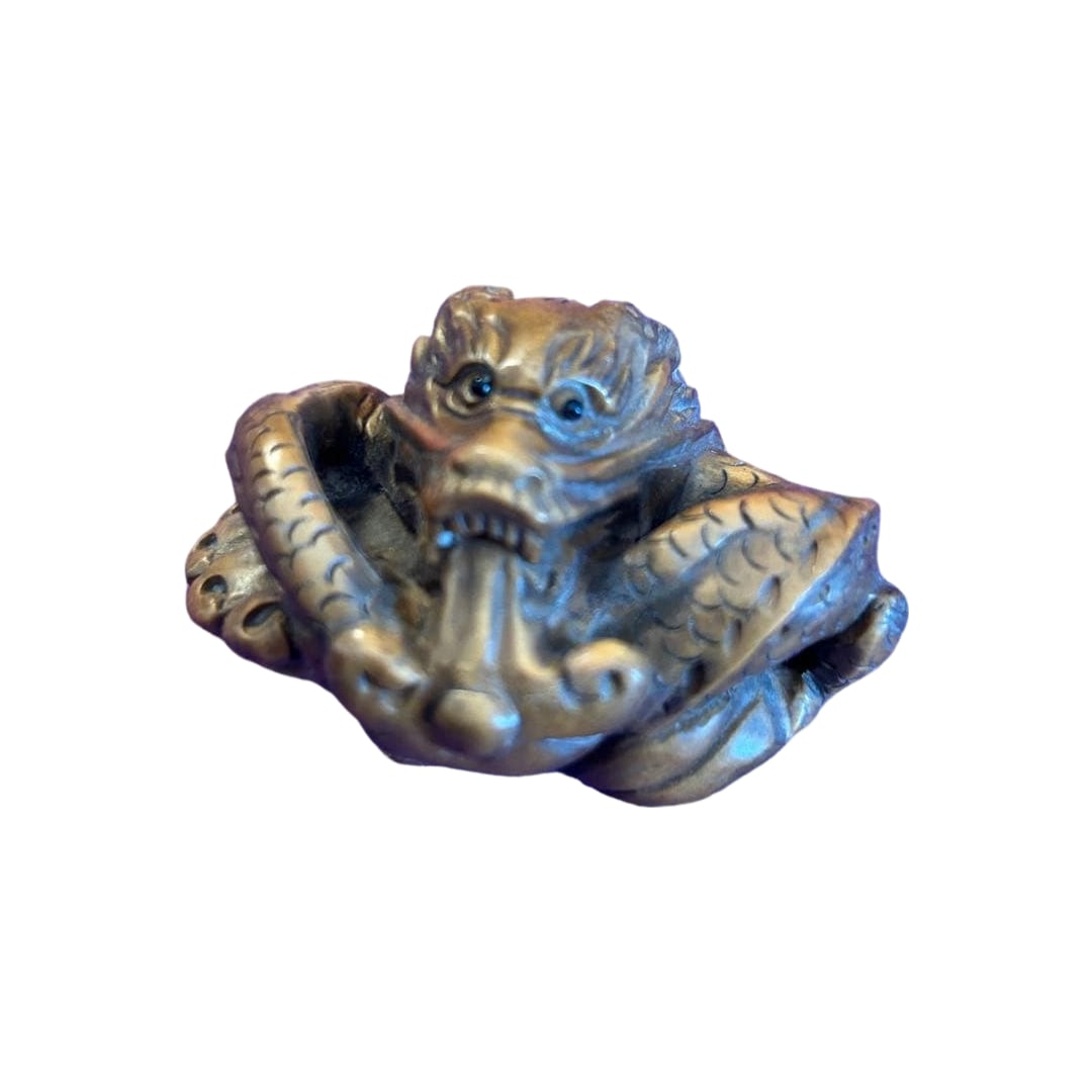 Dragon Carving Netsuke Pendant: This is a finely carved wooden netsuke featuring dragon motifs, with intricate three-dimensional design and distinctive characteristics.