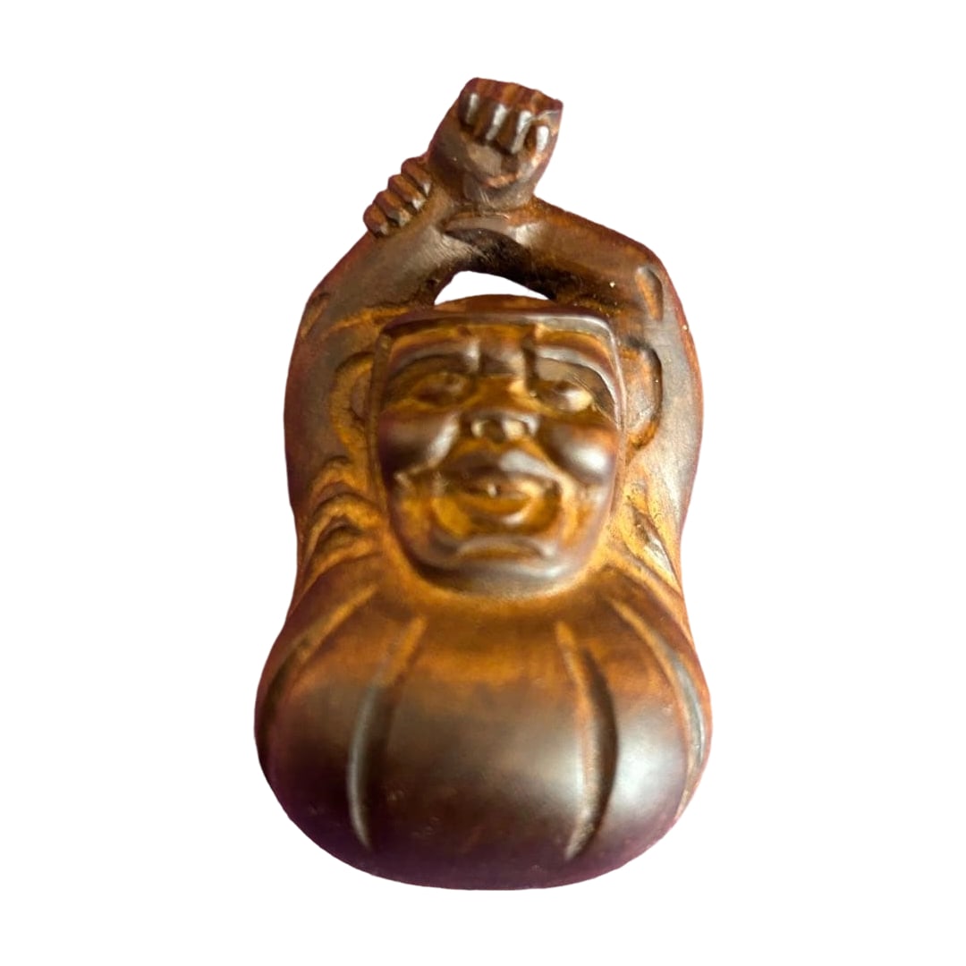 A rare "Yawning (Stretching) Daruma" wood carving netsuke. (1 of 7)