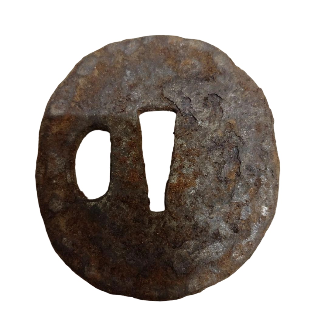 Iron Tsuba Sword Fittings: This is an iron tsuba, exhibiting unique rust and character due to its age, evoking the history of its use as a weapon accessory. Material: Iron Shape: Circular Purpose: Sword fitting Condition: Ruste