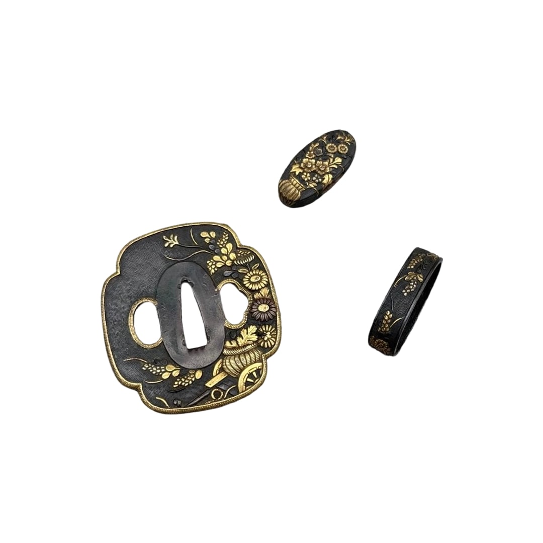 A set of sword fittings with gold inlay featuring floral cart and chrysanthemum patterns on a bronze: This is a set of Japanese sword fittings, comprising a tsuba and fuchi-kashira, crafted using gold inlay technique, exquisitely decorated with chrysanthemum and floral cart motifs. Category: Tsuba & F